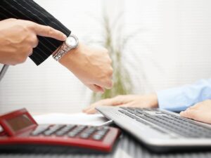 Manager monitoring employee lateness