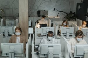 Socially distanced workers in office